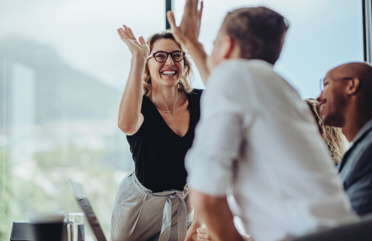 Two people people high fiving
